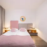 Blue And Green Apartment With Bright Pink Bedroom In Krakow By Noclegi Renters