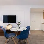 Blue And Green Apartment With Bright Pink Bedroom In Krakow By Noclegi Renters